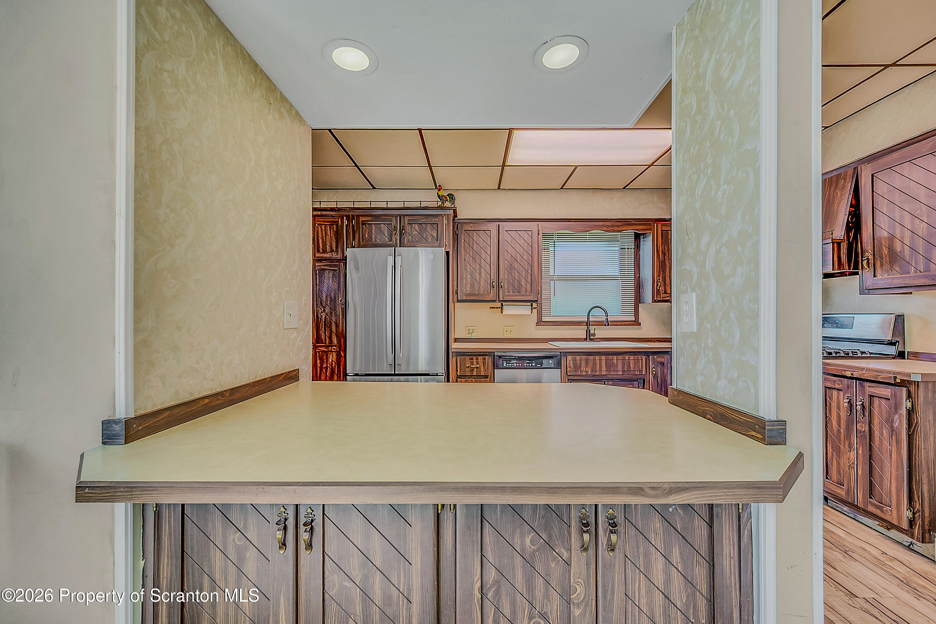 929 Ridge Avenue Scranton, PA 18510 - Photo 18 of 33 a view of a kitchen with a table and chairs