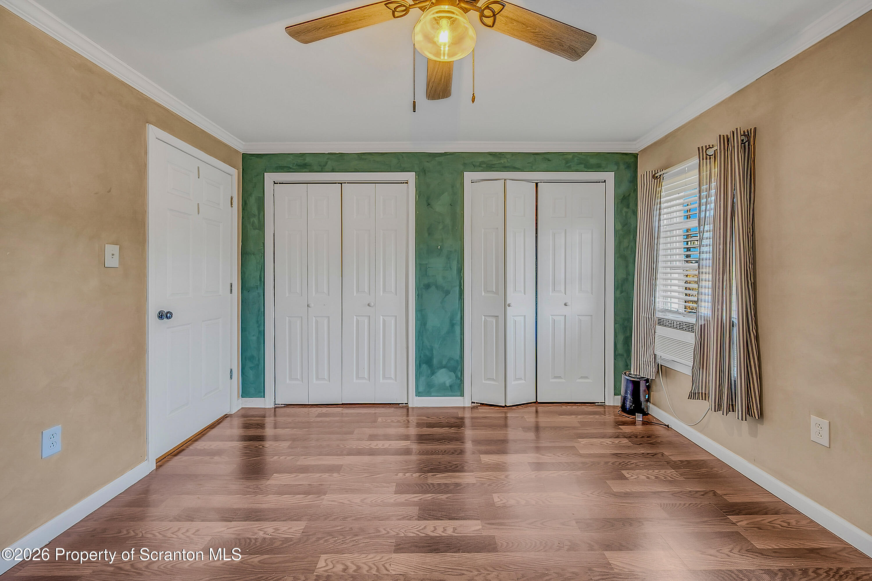 929 Ridge Avenue Scranton, PA 18510 - Photo 21 of 33 an empty room with wooden floor closet and windows