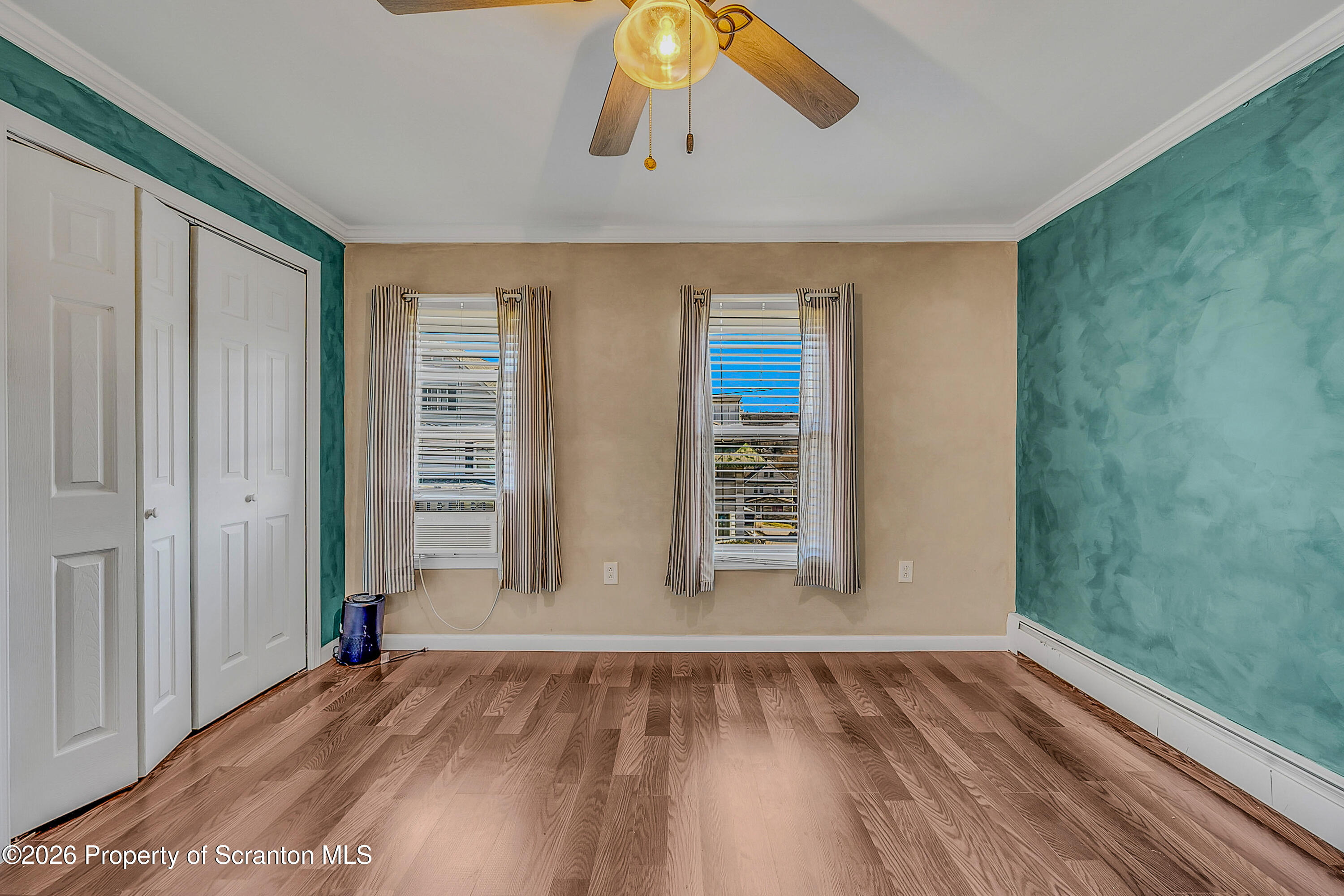 929 Ridge Avenue Scranton, PA 18510 - Photo 22 of 33 an empty room with wooden floor and windows