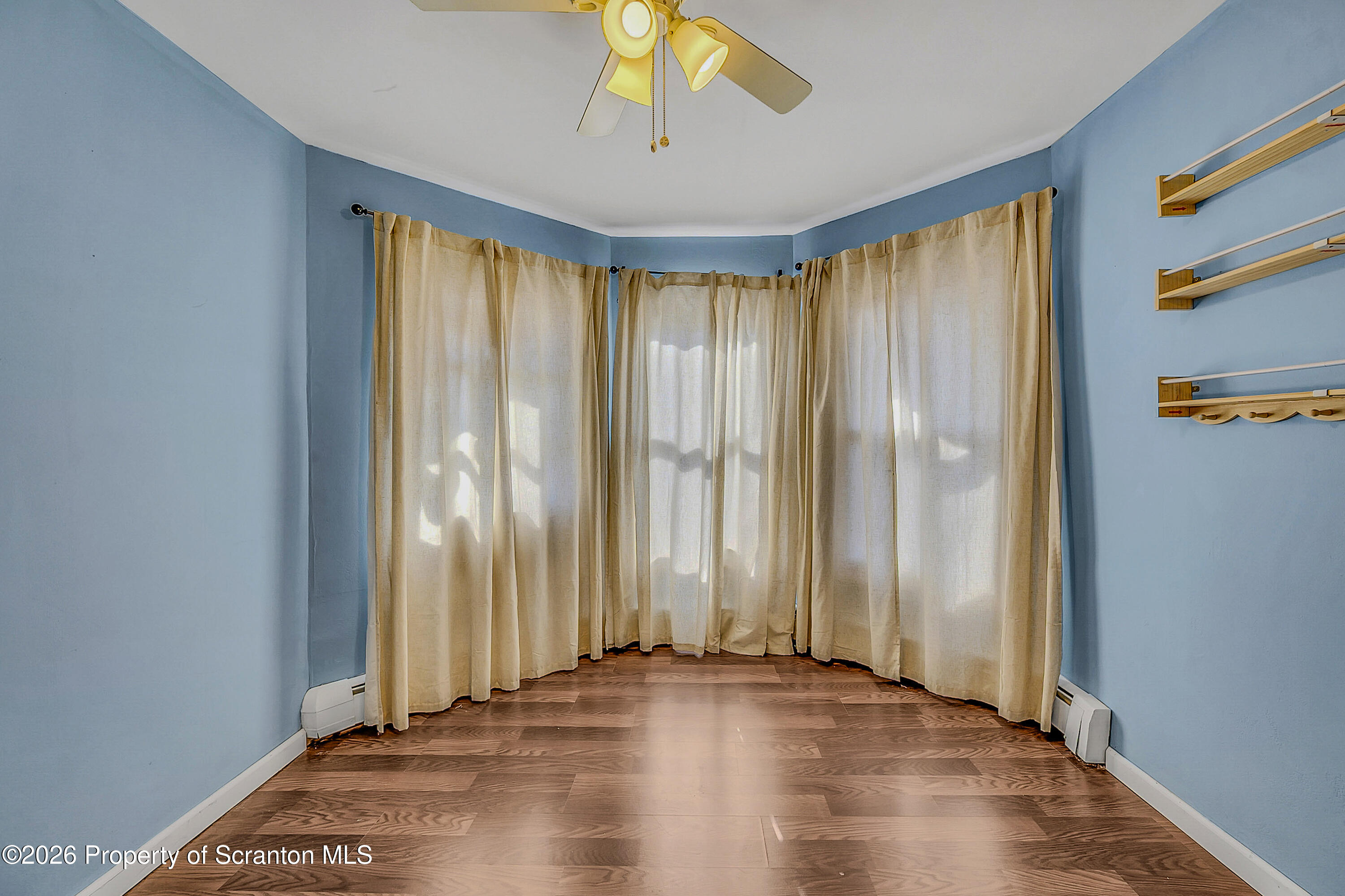 929 Ridge Avenue Scranton, PA 18510 - Photo 23 of 33 an empty room with wooden floor and windows