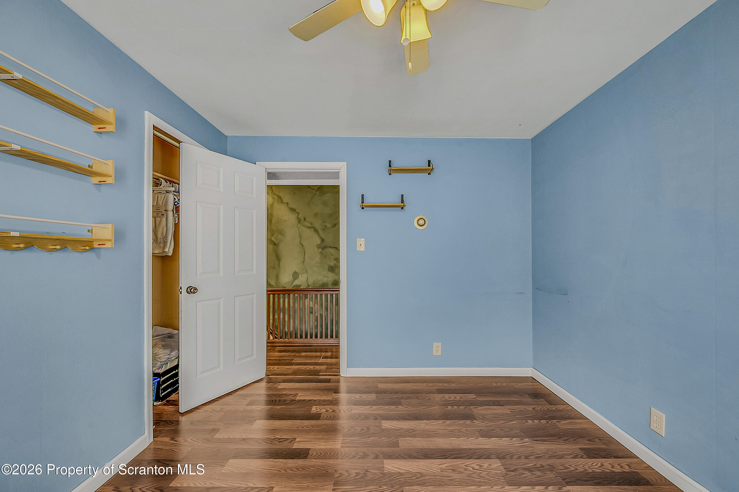 929 Ridge Avenue Scranton, PA 18510 - Photo 24 of 33 a view of an empty room with wooden floor and a window
