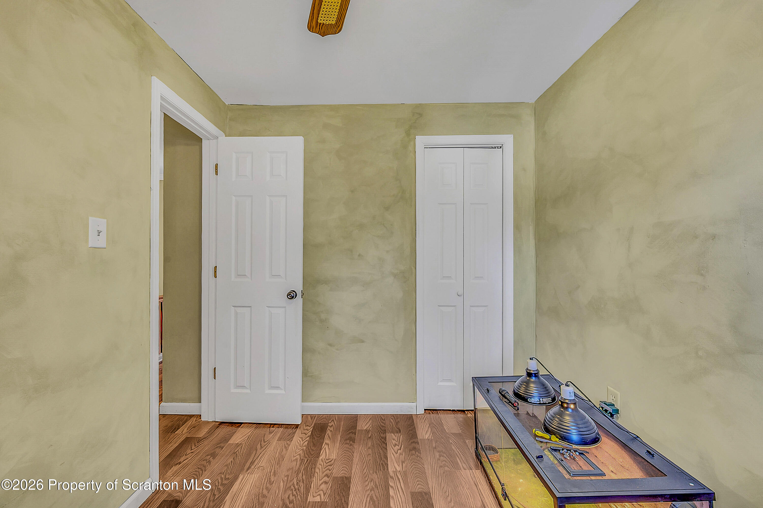929 Ridge Avenue Scranton, PA 18510 - Photo 26 of 33 a view of a room with wooden floor and a ceiling fan