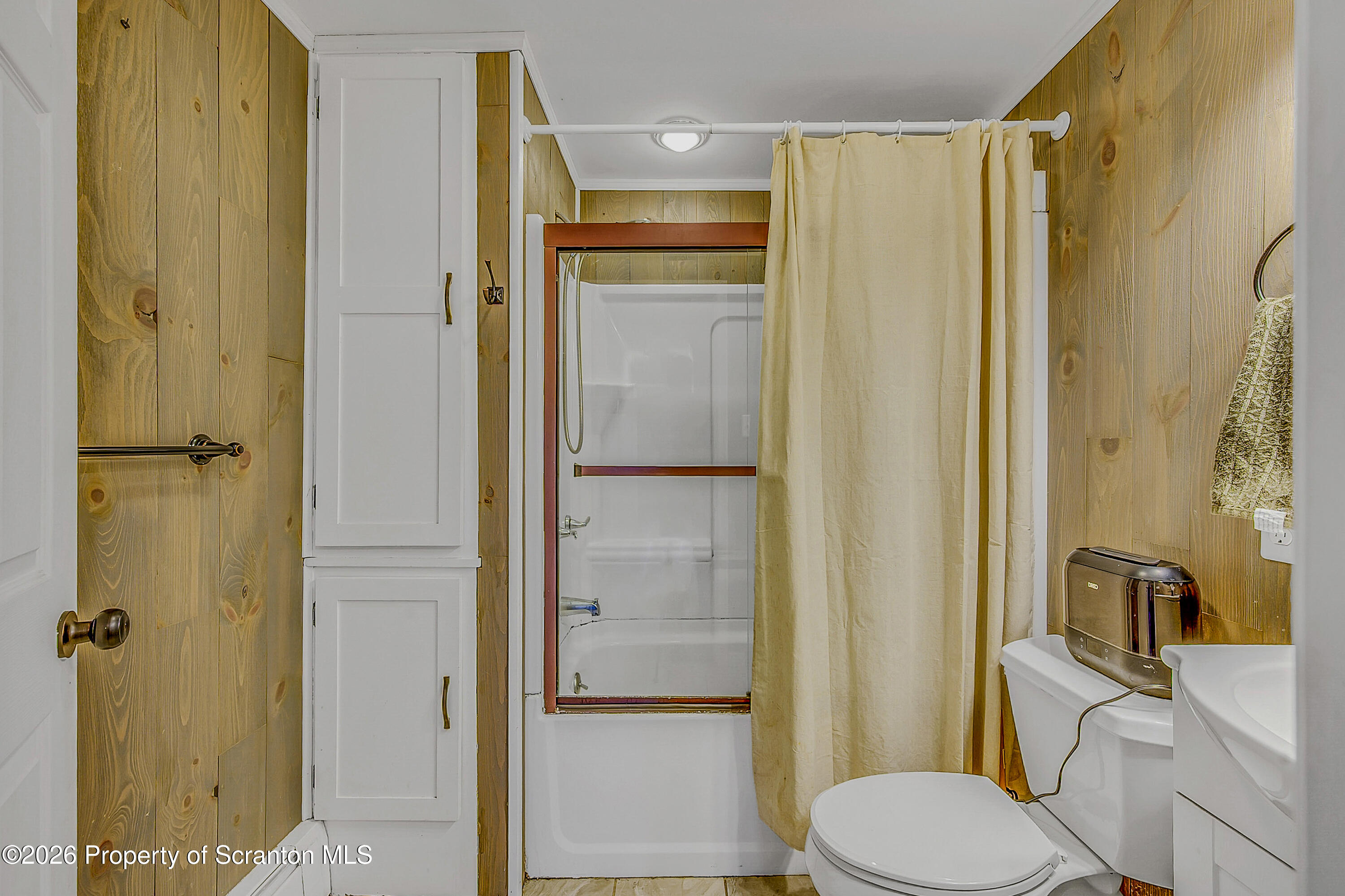 929 Ridge Avenue Scranton, PA 18510 - Photo 27 of 33 a bathroom with a shower and a toilet