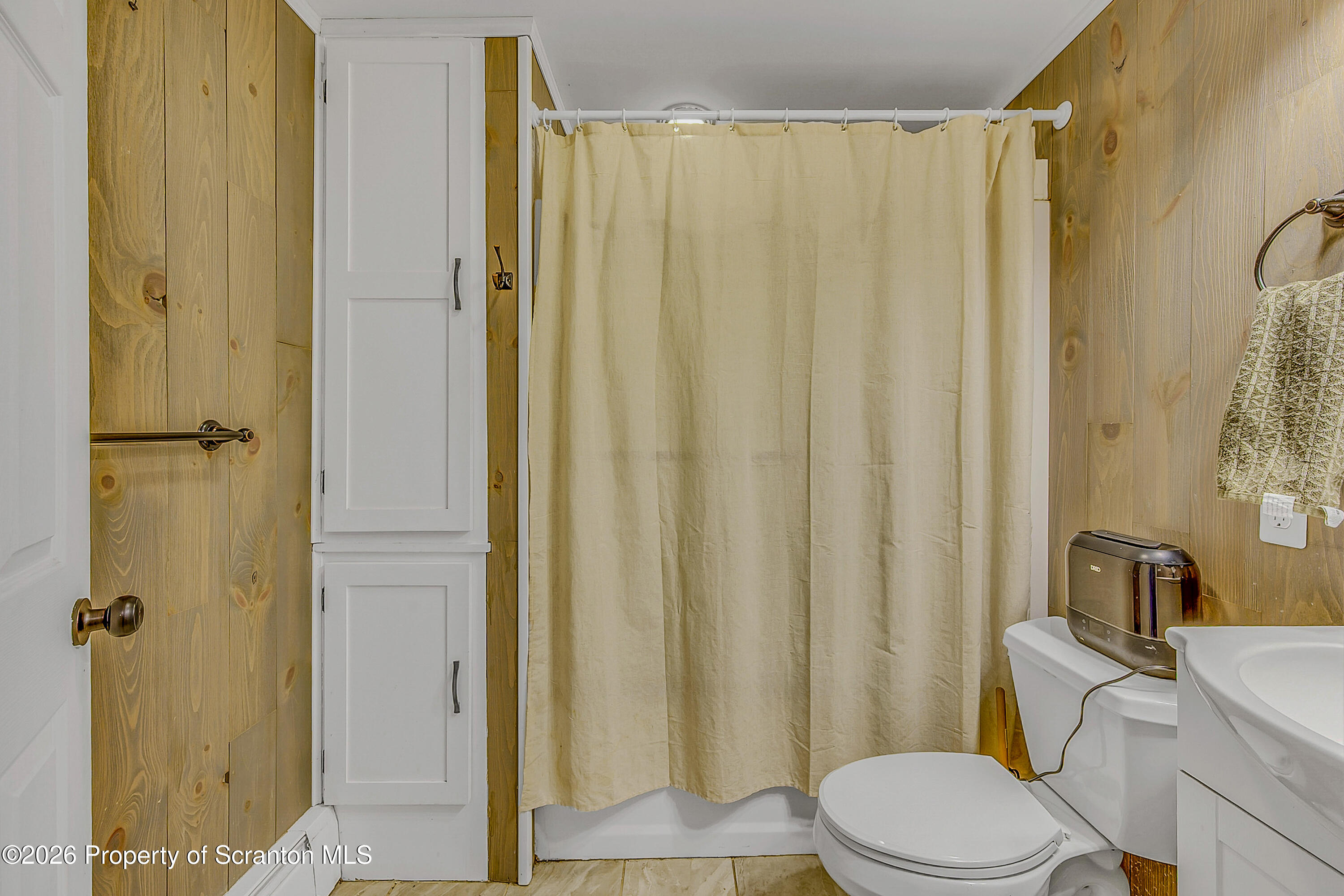 929 Ridge Avenue Scranton, PA 18510 - Photo 31 of 33 a white toilet sitting next to a bathroom