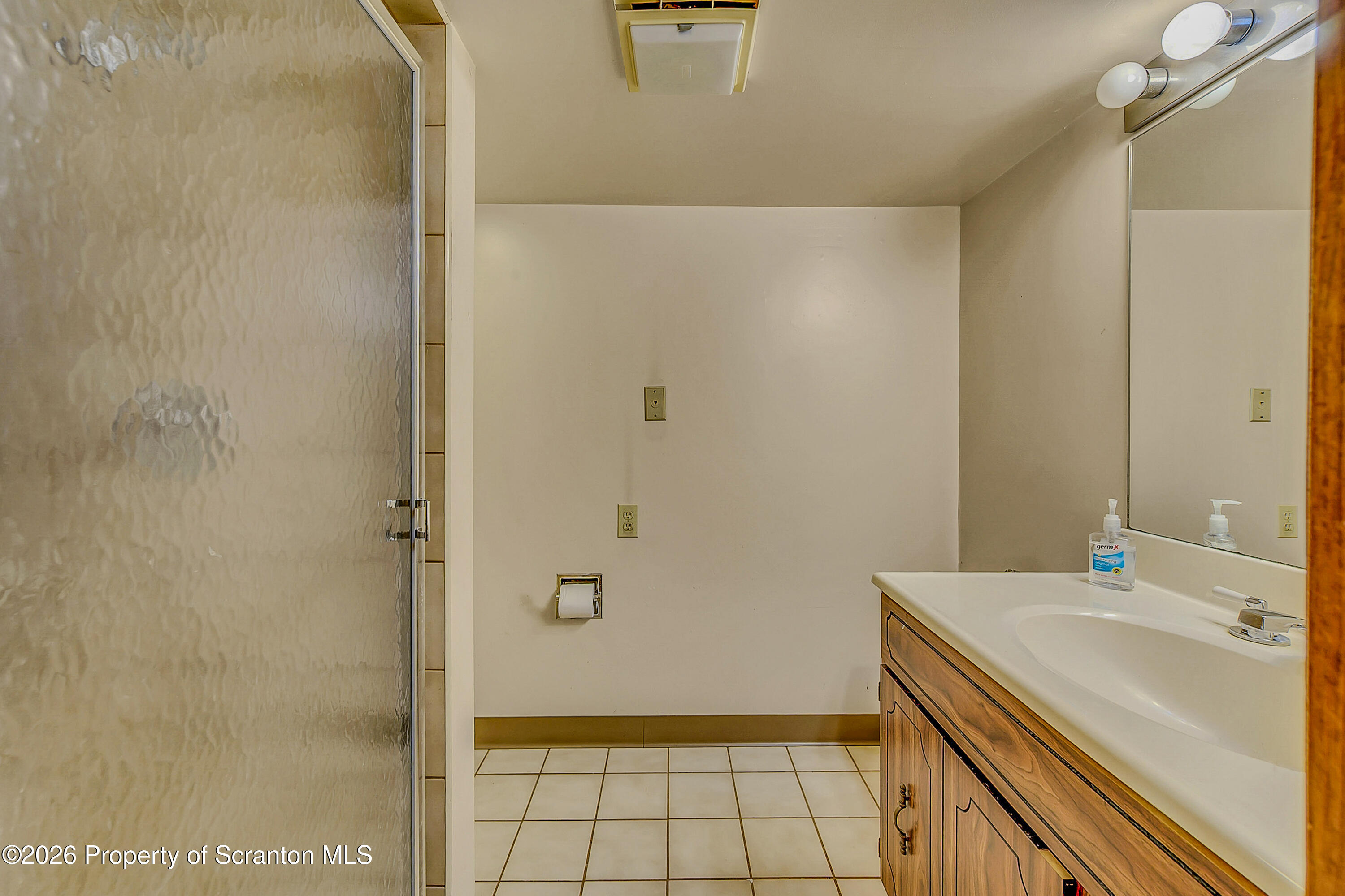 929 Ridge Avenue Scranton, PA 18510 - Photo 32 of 33 a bathroom with a sink and shower