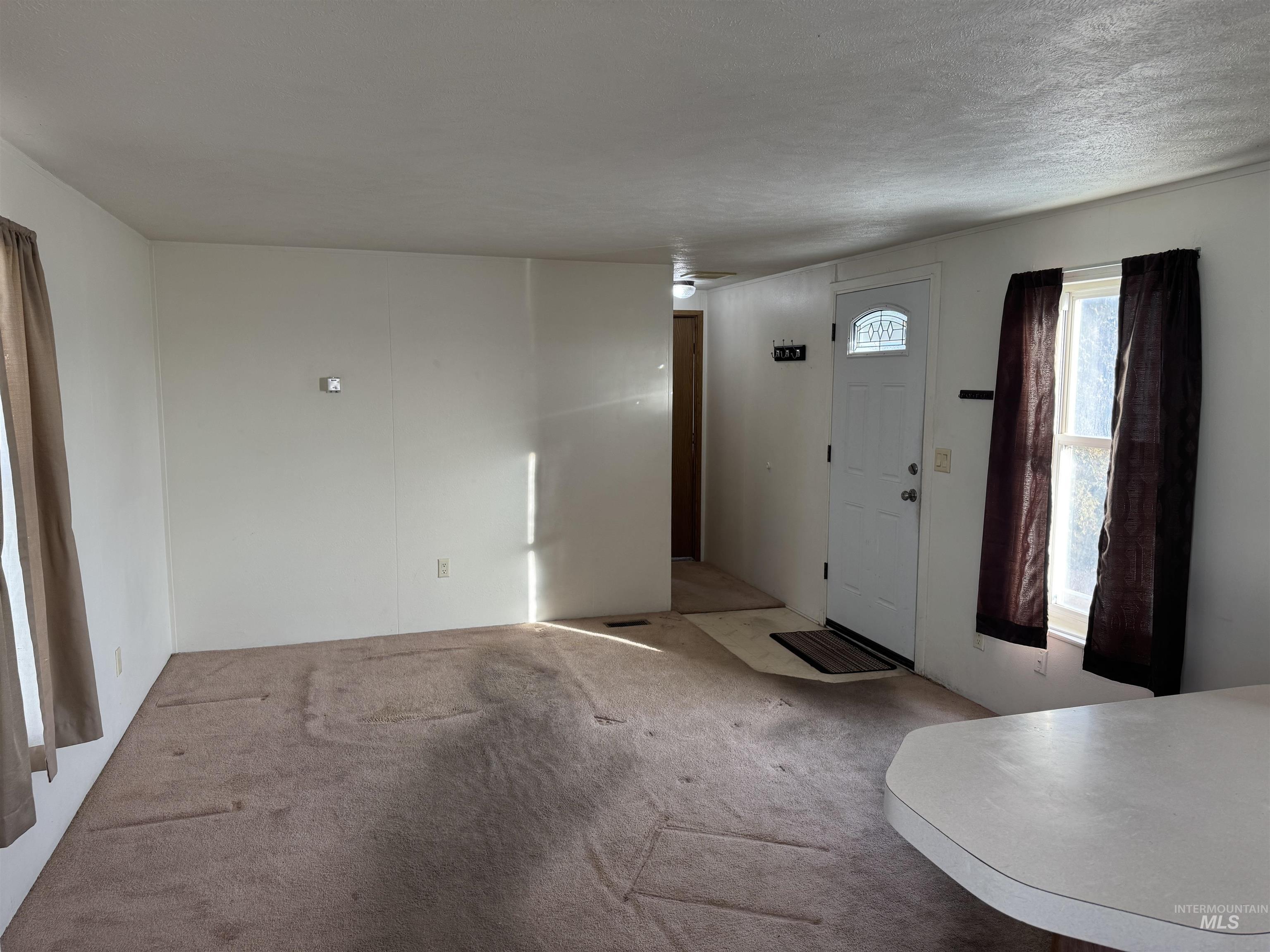 198 South Hills Road, Unit 83 Twin Falls, ID 83301 - Photo 6 of 21 View of carpeted entryway