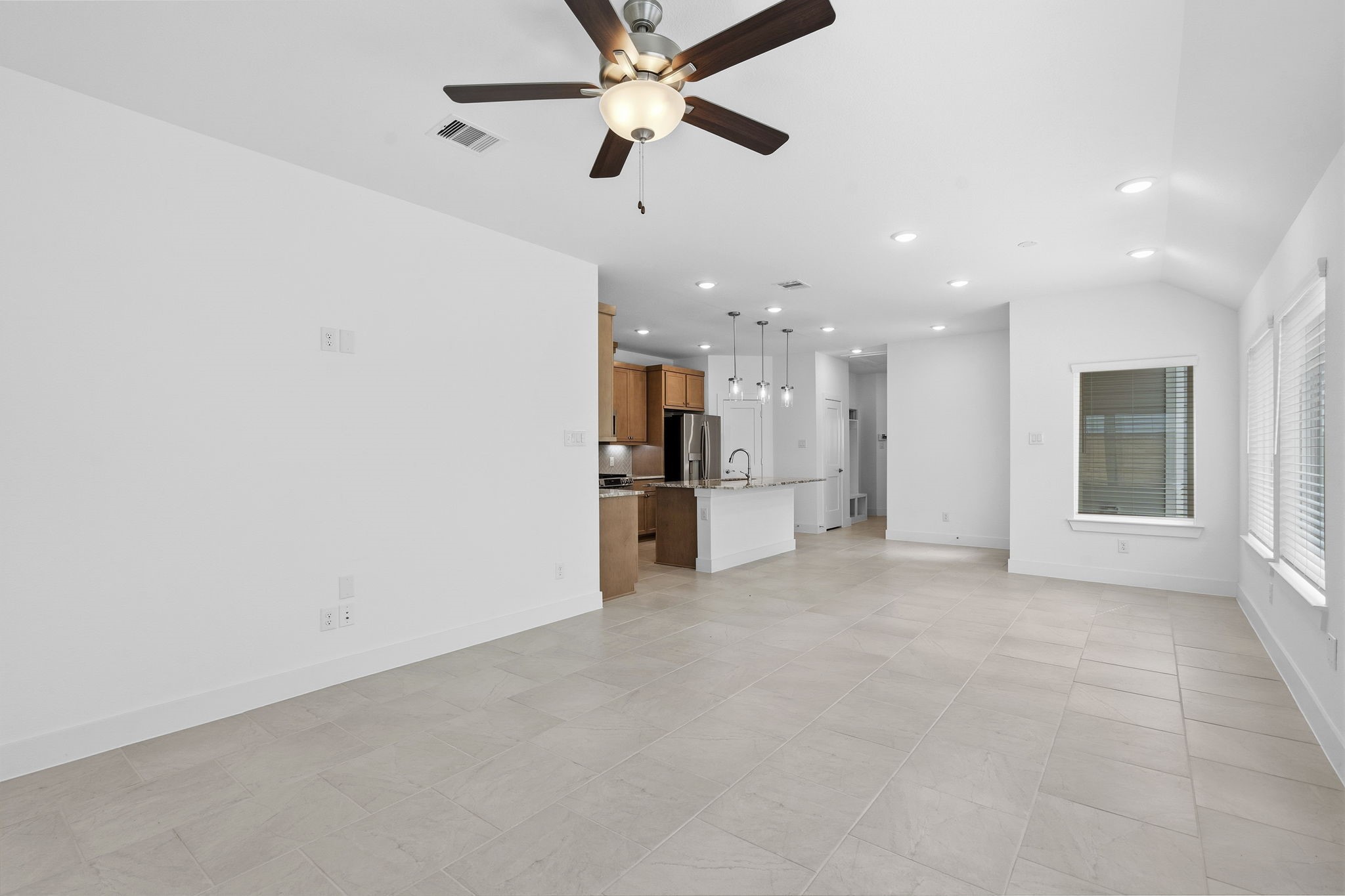 5251 Celestial Court Rosharon, TX 77583 - Photo 20 of 46 a view of a kitchen with a sink and a refrigerator