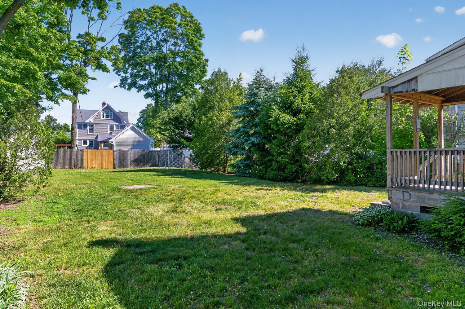 49 Cedar Street Babylon, NY 11702 - Photo 20 of 20 a view of a backyard with a garden