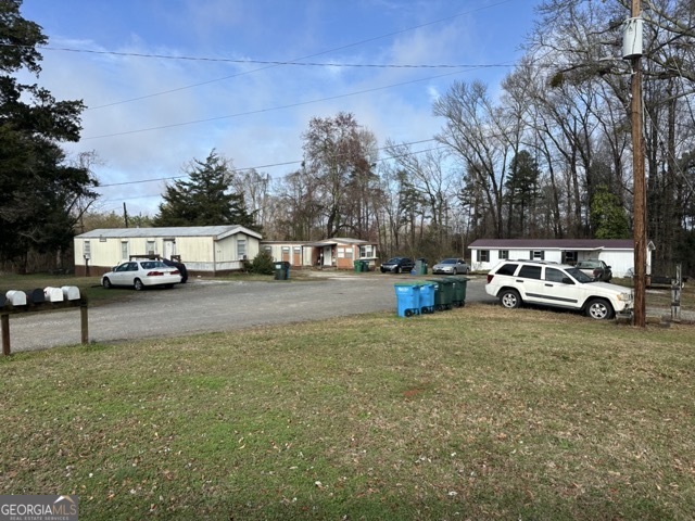 581-603 Ila Road Commerce, GA 30529 - Photo 3 of 10 a view of road with parked cars