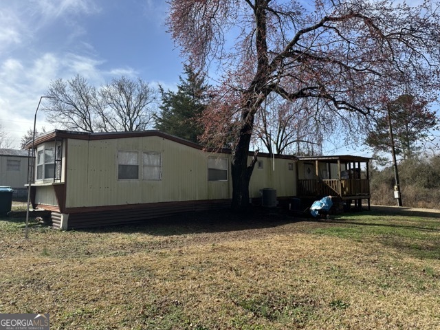 581-603 Ila Road Commerce, GA 30529 - Photo 9 of 10 a view of house with yard