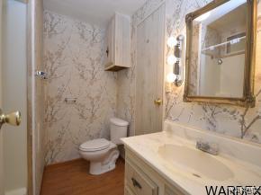 1726 Ramar Road Bullhead City, AZ 86442 - Photo 11 of 20 a bathroom with a sink toilet and shower