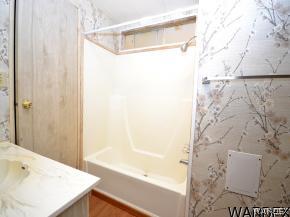 1726 Ramar Road Bullhead City, AZ 86442 - Photo 12 of 20 a bathroom with a bathtub and shower