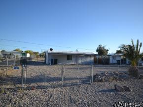 1726 Ramar Road Bullhead City, AZ 86442 - Photo 17 of 20 a view of a house with a backyard