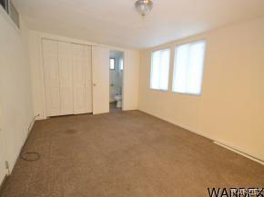 1726 Ramar Road Bullhead City, AZ 86442 - Photo 6 of 20 an empty room with windows
