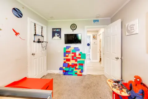 a room with toys and a flat screen tv