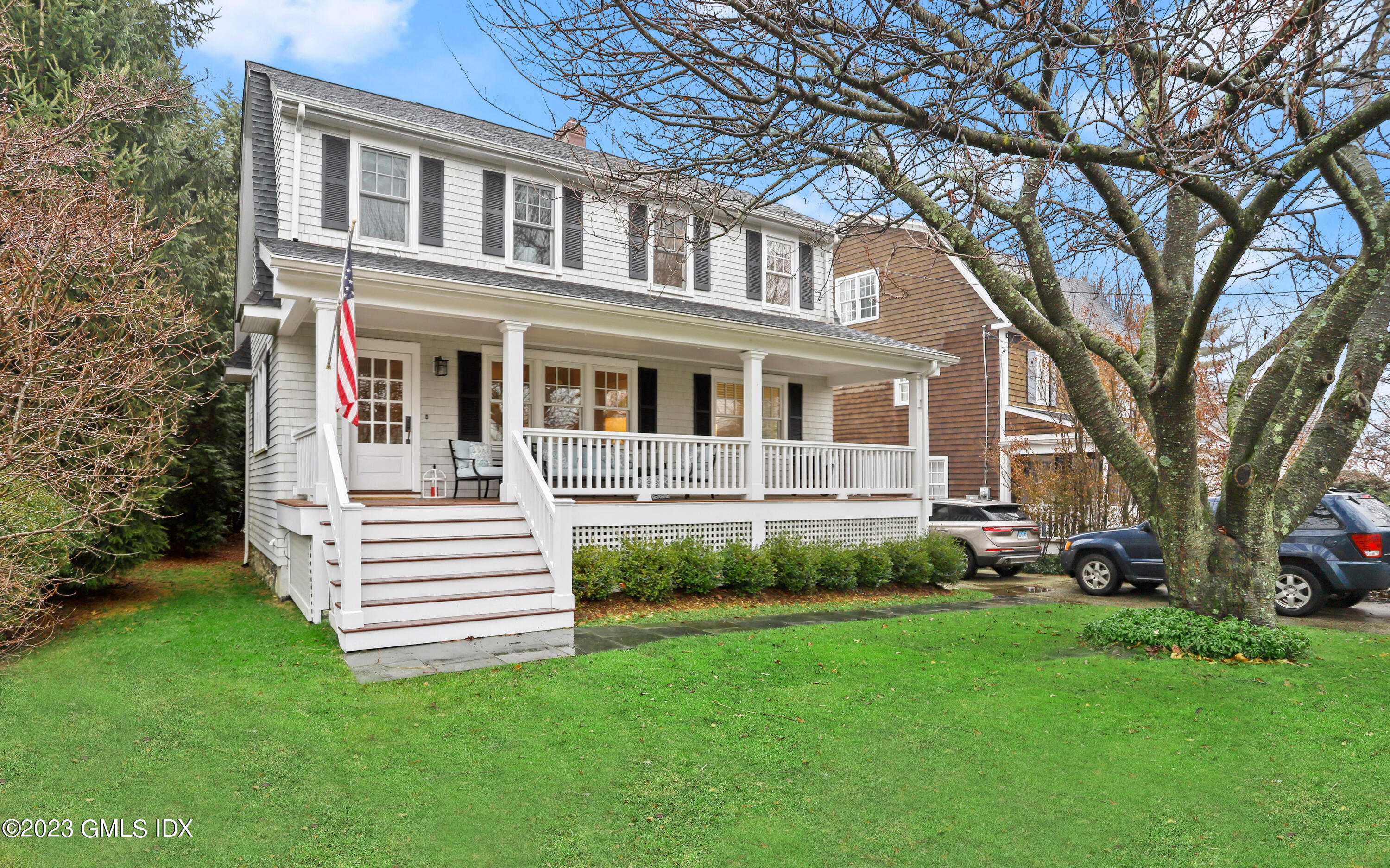 a view of a house with a yard porch and sitting area