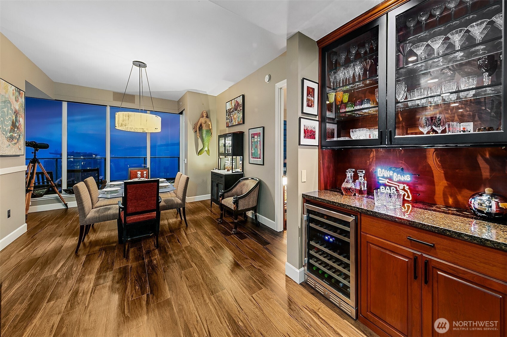 1920 4th Avenue, Unit 2802 Seattle, WA 98101 - Photo 13 of 40 a living room with furniture a piano and a bookshelf