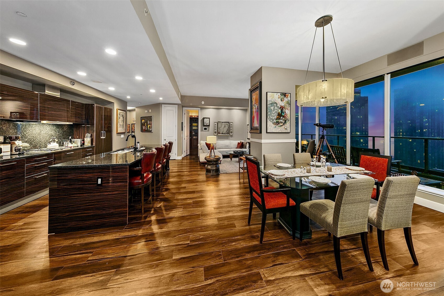 1920 4th Avenue, Unit 2802 Seattle, WA 98101 - Photo 14 of 40 a large kitchen with a table and chairs in it