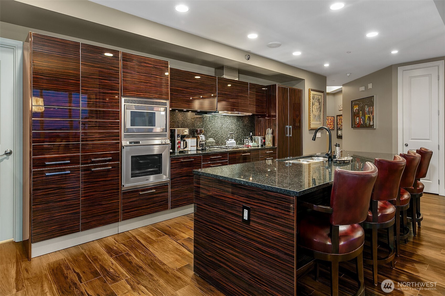 1920 4th Avenue, Unit 2802 Seattle, WA 98101 - Photo 18 of 40 a kitchen with a sink and cabinets