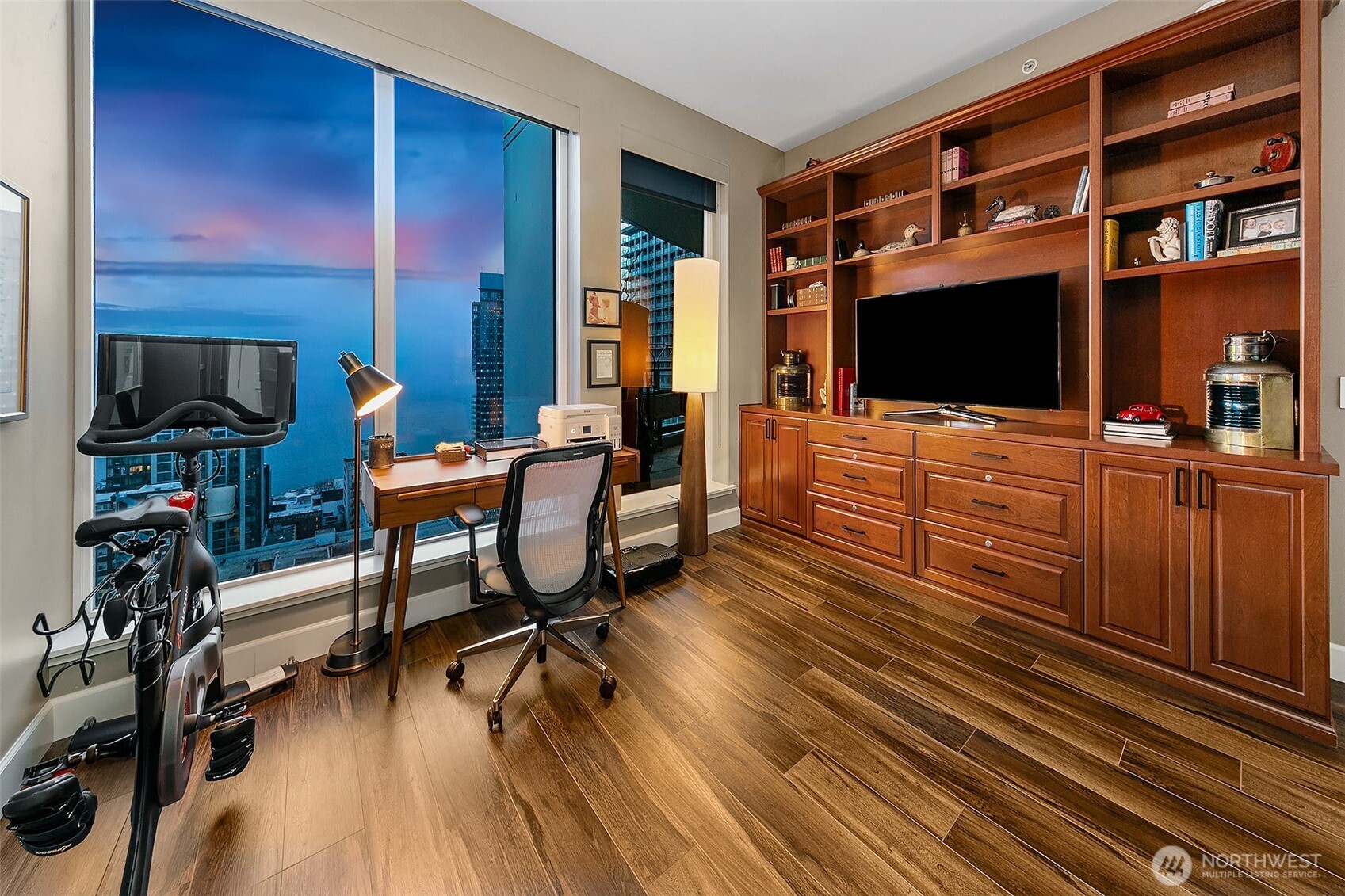 1920 4th Avenue, Unit 2802 Seattle, WA 98101 - Photo 21 of 40 a living room with furniture and a flat screen tv