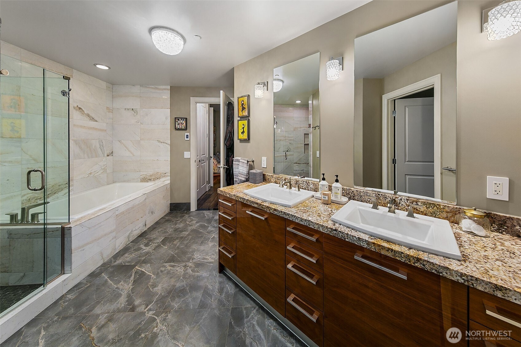 1920 4th Avenue, Unit 2802 Seattle, WA 98101 - Photo 27 of 40 a bathroom with a granite countertop sink mirror and a bath tub