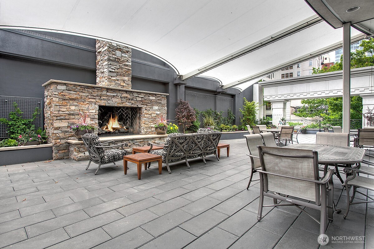 1920 4th Avenue, Unit 2802 Seattle, WA 98101 - Photo 33 of 40 a living room with furniture and a fireplace