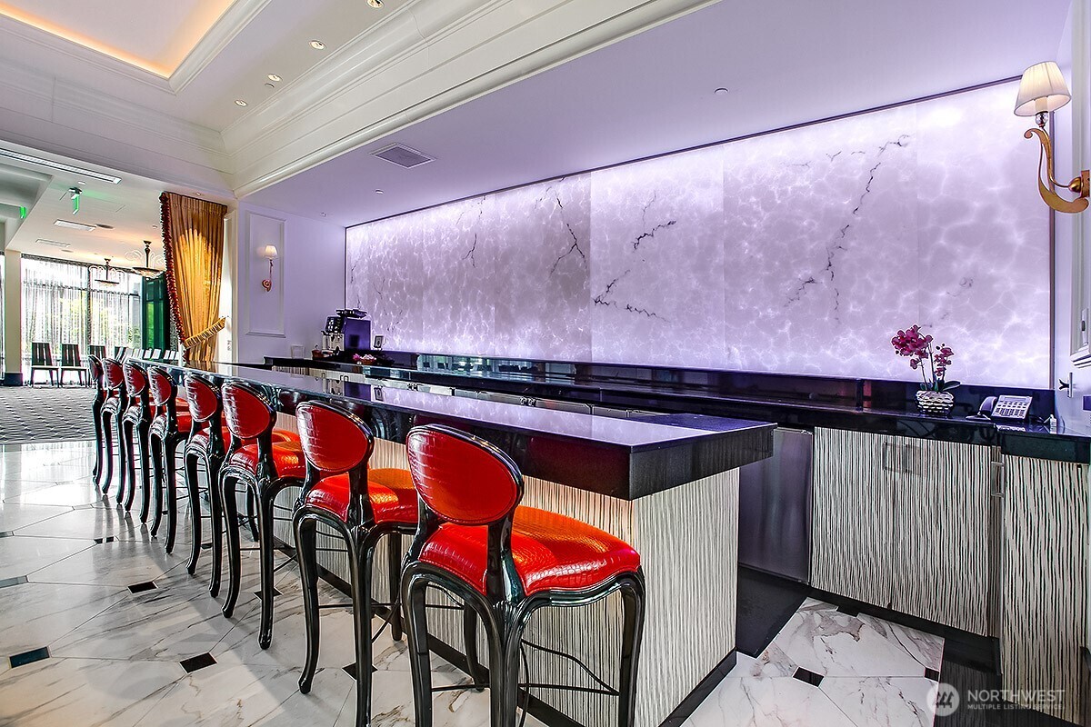 1920 4th Avenue, Unit 2802 Seattle, WA 98101 - Photo 34 of 40 a kitchen with stainless steel appliances granite countertop a sink and cabinets