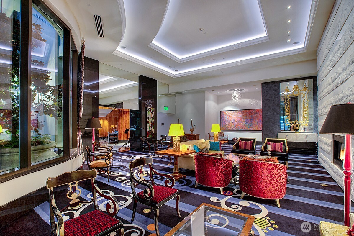 1920 4th Avenue, Unit 2802 Seattle, WA 98101 - Photo 35 of 40 a living room with fireplace furniture and a flat screen tv