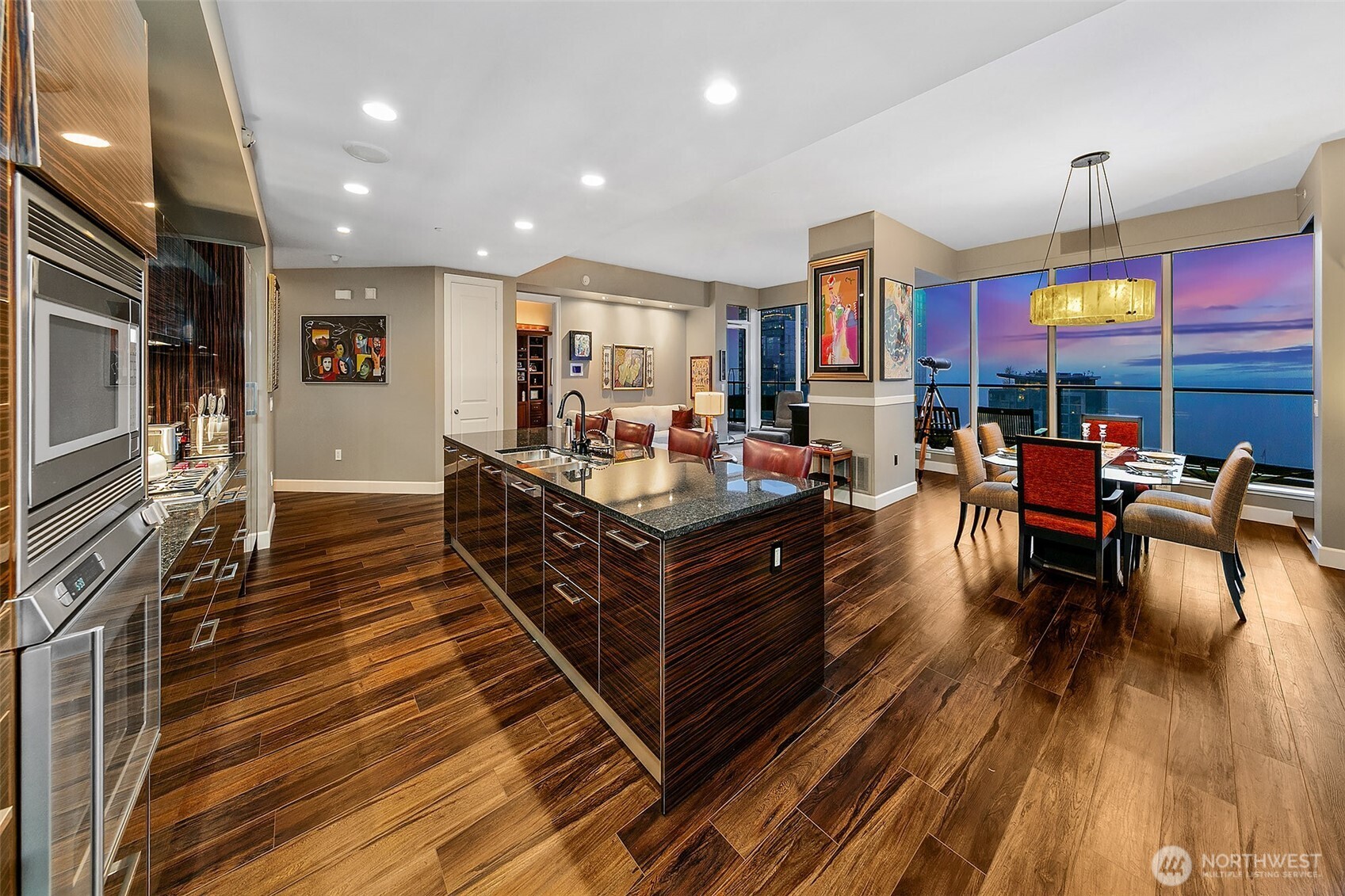 1920 4th Avenue, Unit 2802 Seattle, WA 98101 - Photo 9 of 40 a living room with furniture a wooden floor and a sink