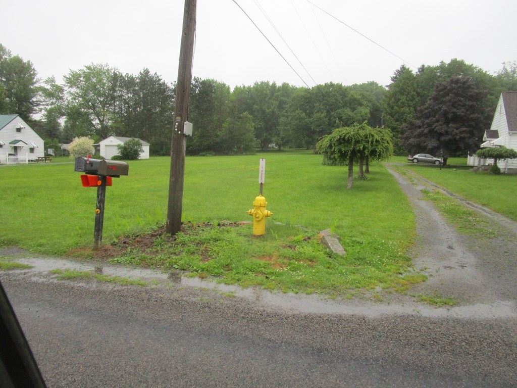 0 Country Club Road Brookville, PA 15825 - Photo 2 of 6 a backyard of a house with table and chairs