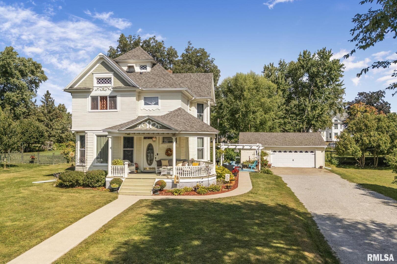 109 West 6th Street Wilton, IA 52778 - Photo 1 of 40 a front view of a house with swimming pool yard and patio