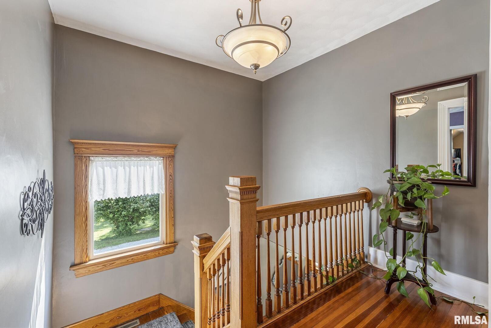 109 West 6th Street Wilton, IA 52778 - Photo 25 of 40 a view of a livingroom with wooden floor and a window