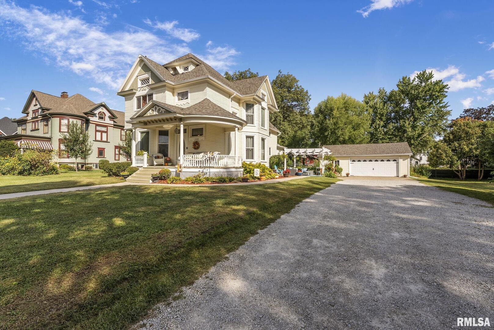 109 West 6th Street Wilton, IA 52778 - Photo 26 of 40 a front view of a house with a garden