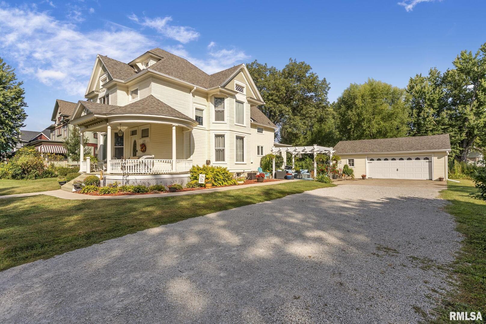109 West 6th Street Wilton, IA 52778 - Photo 28 of 40 a front view of a house with garden