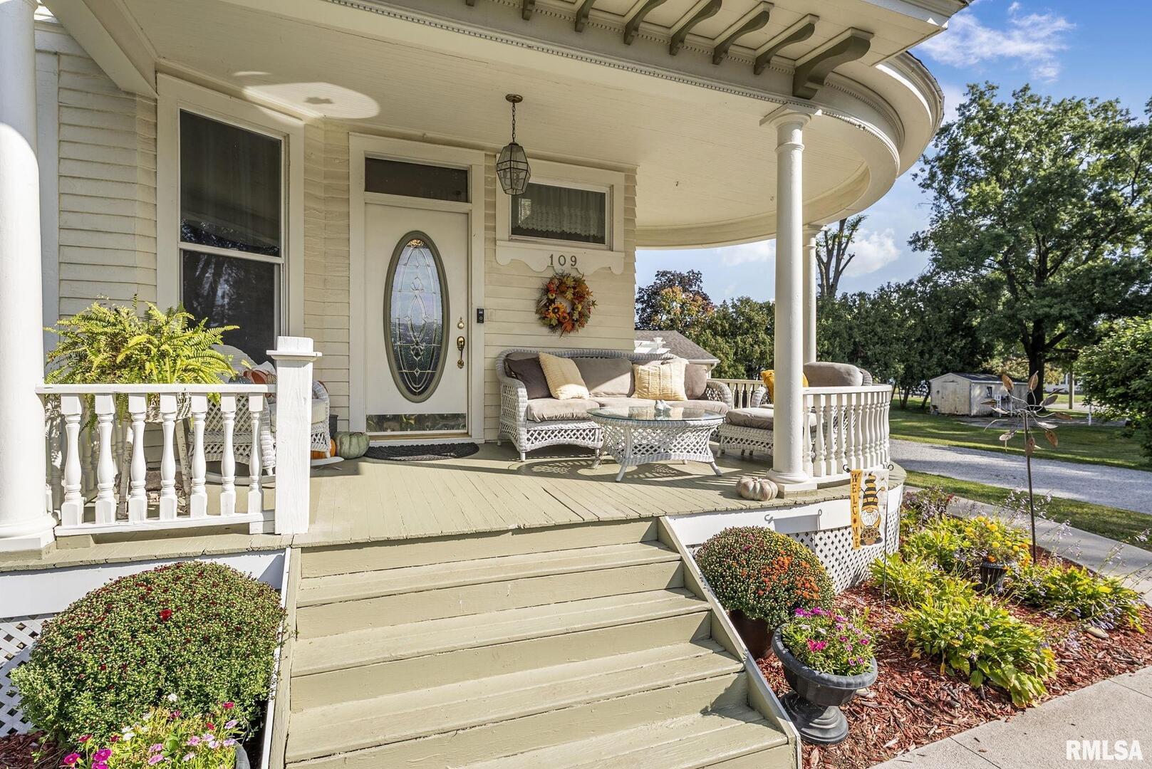 109 West 6th Street Wilton, IA 52778 - Photo 29 of 40 a view of a swimming pool with a porch