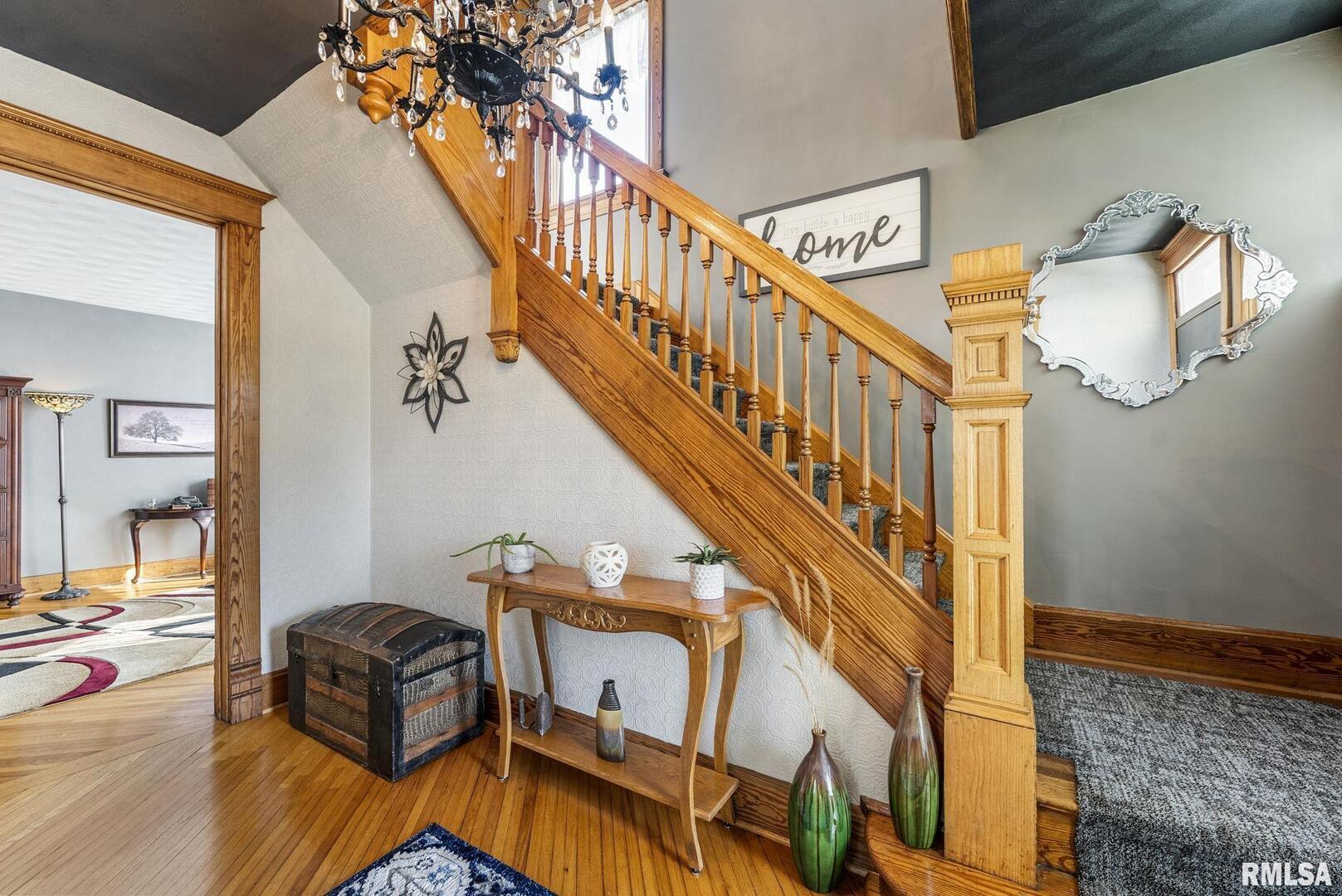 109 West 6th Street Wilton, IA 52778 - Photo 3 of 40 a view of entryway and hall with wooden floor