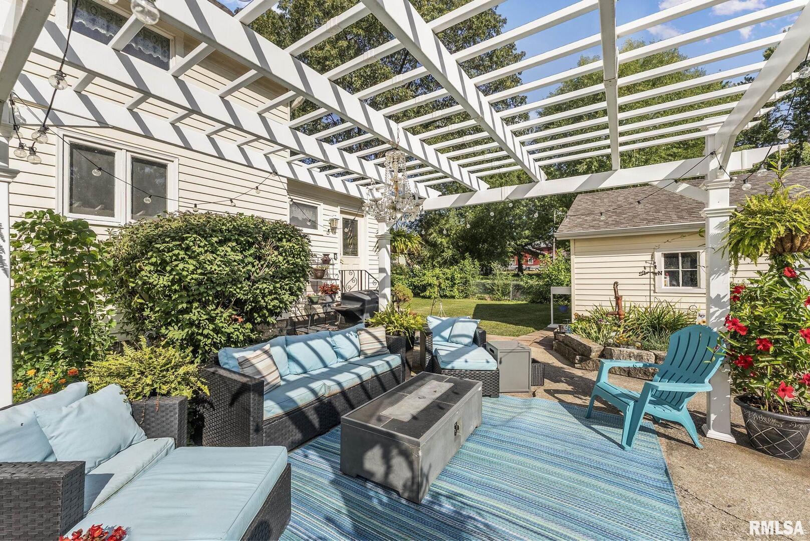 109 West 6th Street Wilton, IA 52778 - Photo 34 of 40 a view of a patio with couches and potted plants