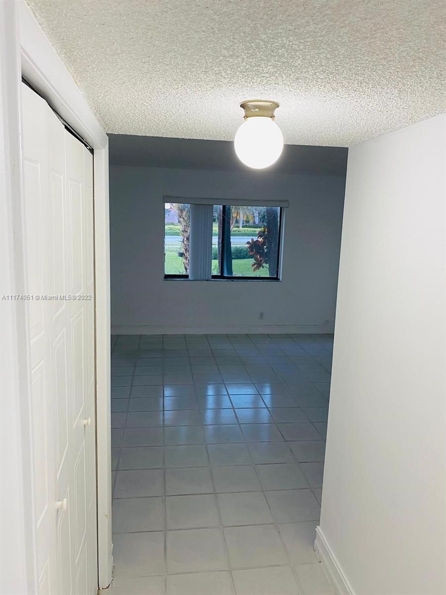 380 Racquet Club Road, Unit 103 Weston, FL 33326 - Photo 16 of 25 a view of a livingroom with a window