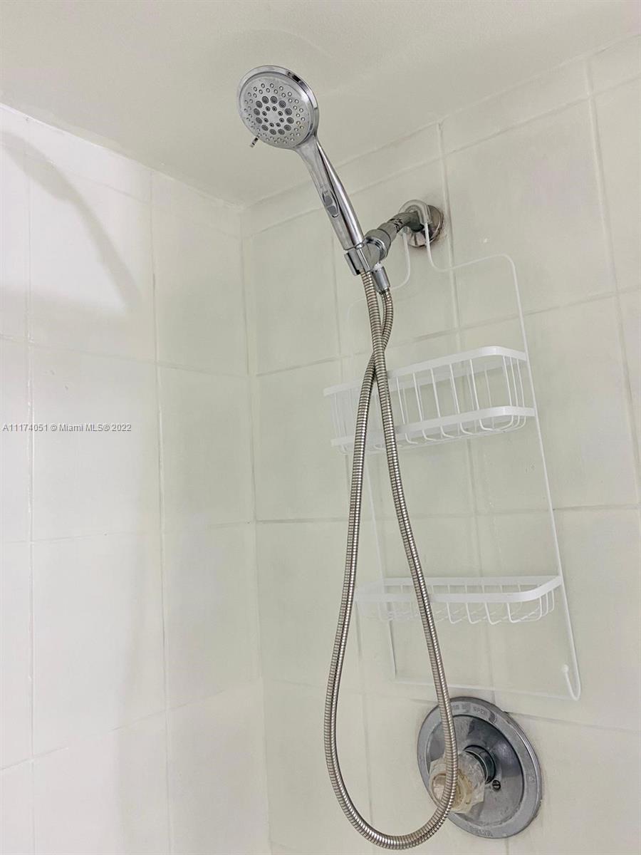 380 Racquet Club Road, Unit 103 Weston, FL 33326 - Photo 19 of 25 a bathroom with a sink