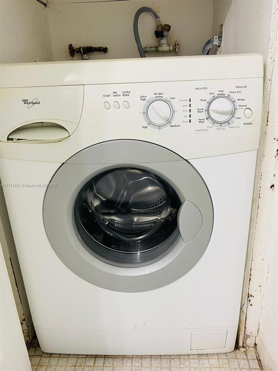 380 Racquet Club Road, Unit 103 Weston, FL 33326 - Photo 20 of 25 a utility room with a washer and dryer