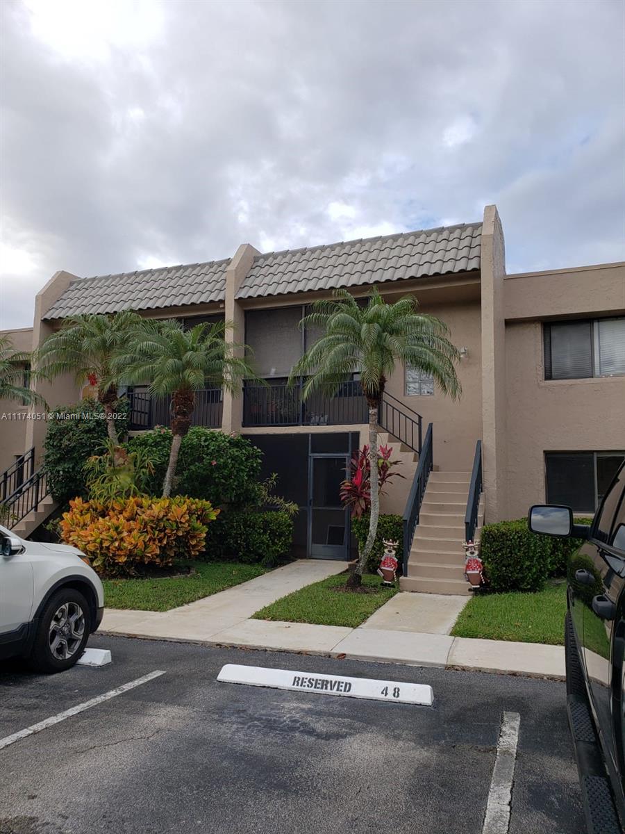 380 Racquet Club Road, Unit 103 Weston, FL 33326 - Photo 2 of 25 a view of a car garage