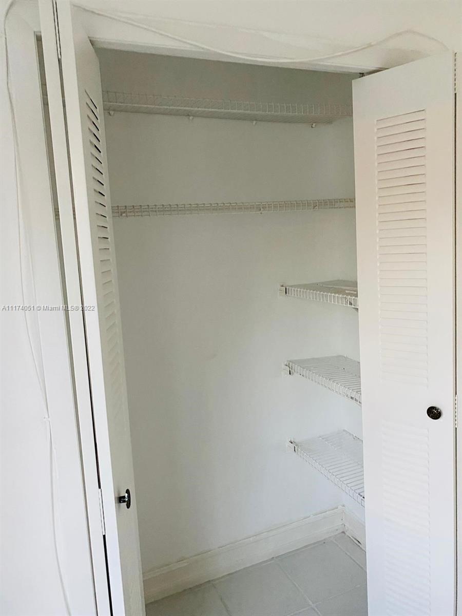 380 Racquet Club Road, Unit 103 Weston, FL 33326 - Photo 23 of 25 a view of a closet