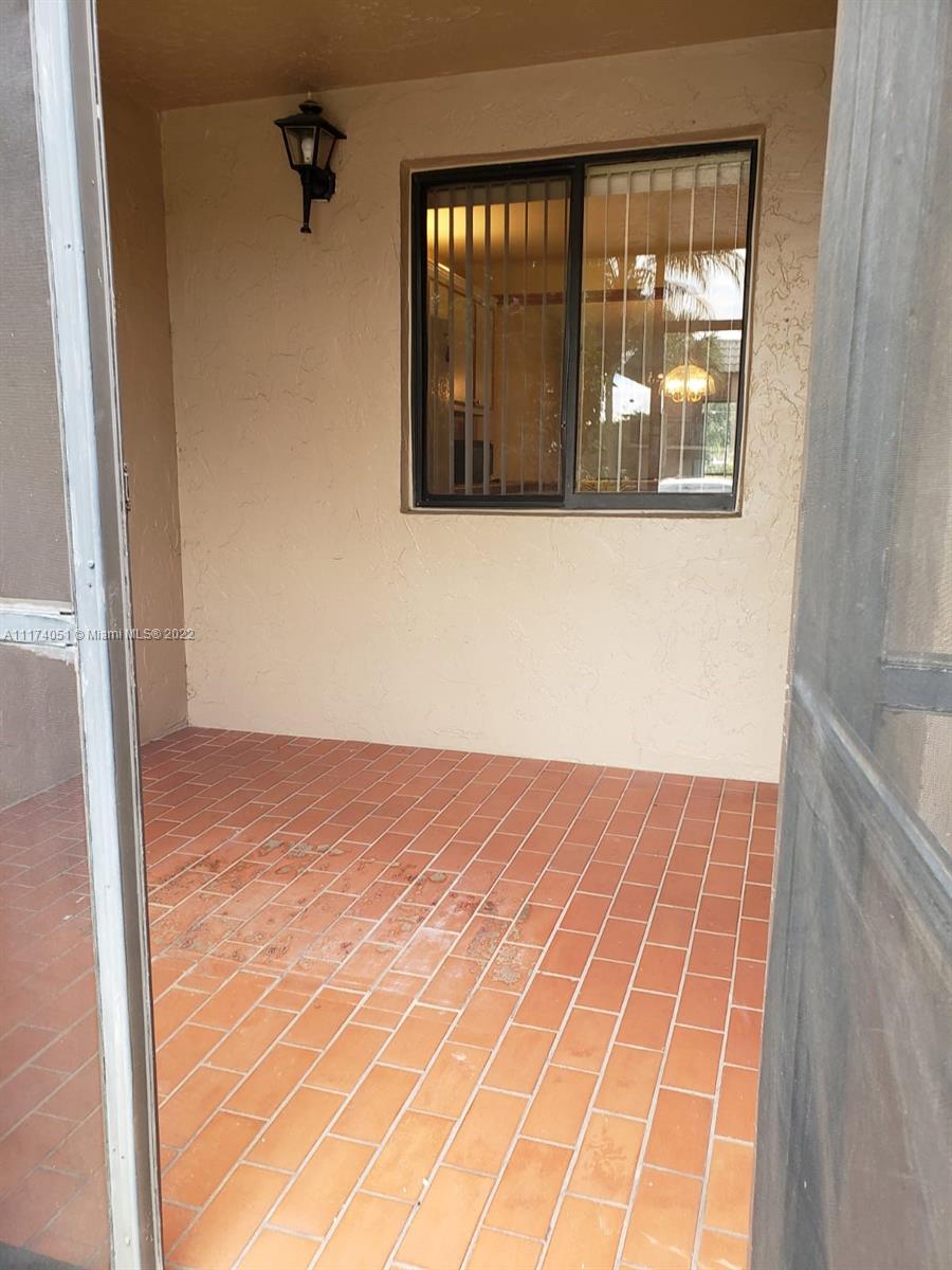 380 Racquet Club Road, Unit 103 Weston, FL 33326 - Photo 4 of 25 a view of an empty room with a window