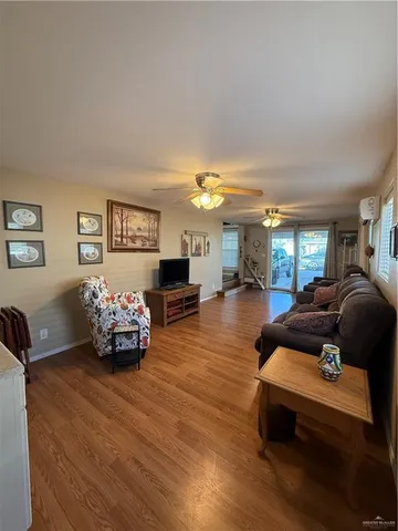 a kitchen with a refrigerator and a stove top oven