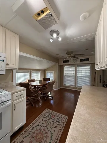 a kitchen with lots of counter top space and appliances