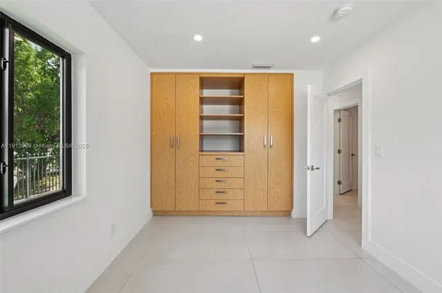 a bathroom with a toilet a sink and shower