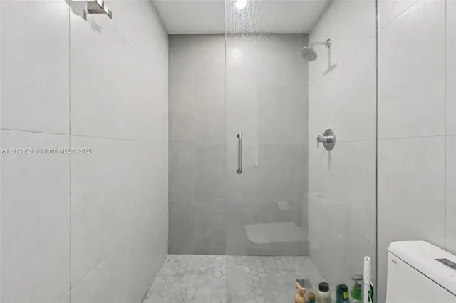 a kitchen with stainless steel appliances a sink stove and refrigerator