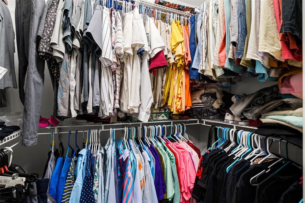 12015 Phoenix Avenue Weeki Wachee, FL 34614 - Photo 21 of 39 a view of walk in closet with clothes