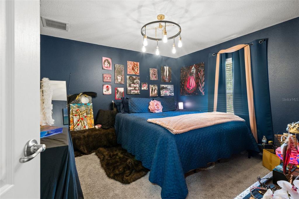 12015 Phoenix Avenue Weeki Wachee, FL 34614 - Photo 26 of 39 a bedroom with bed and window