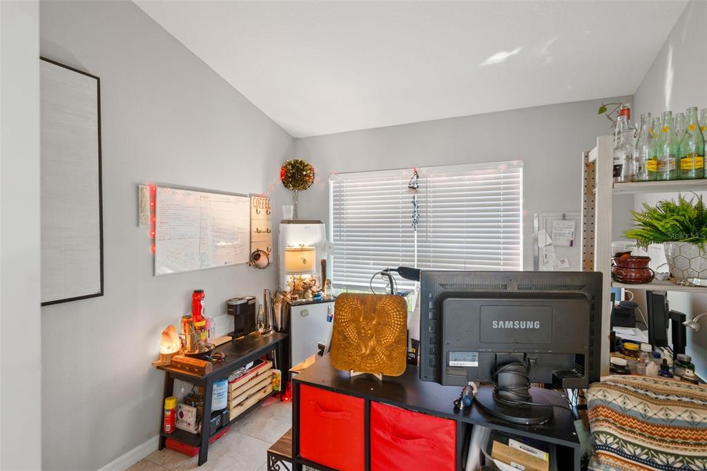 12015 Phoenix Avenue Weeki Wachee, FL 34614 - Photo 27 of 39 a bedroom with furniture and a window